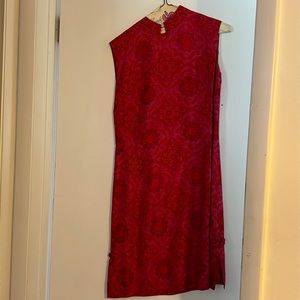 Sleeveless silk dress size small, beautiful side ornate. short knee length.